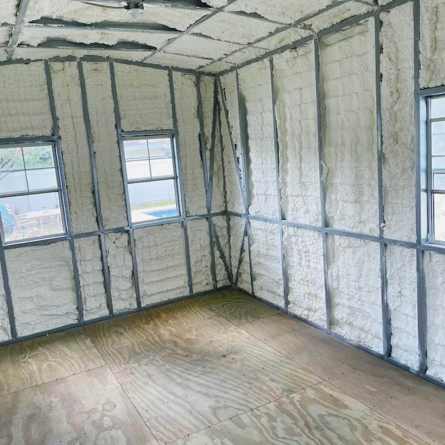 Closed-cell spray foam insulation applied to wall cavities in a residential project in Vista